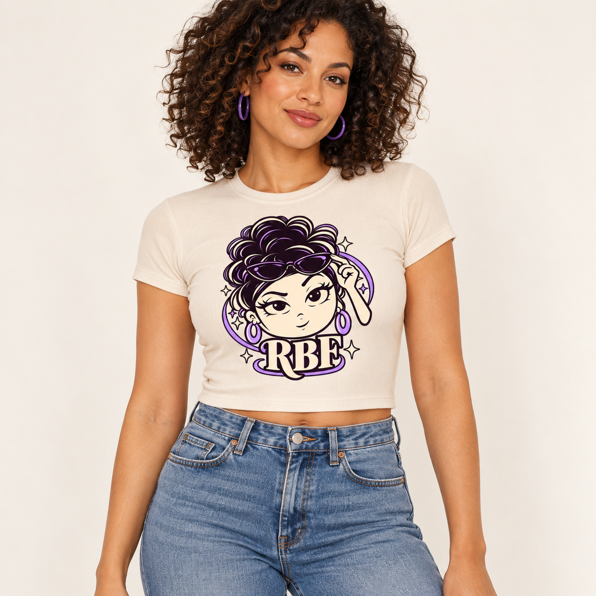 Digital design preview: adult woman wearing the Chan Signature women’s baby tee in natural. Coming soon.