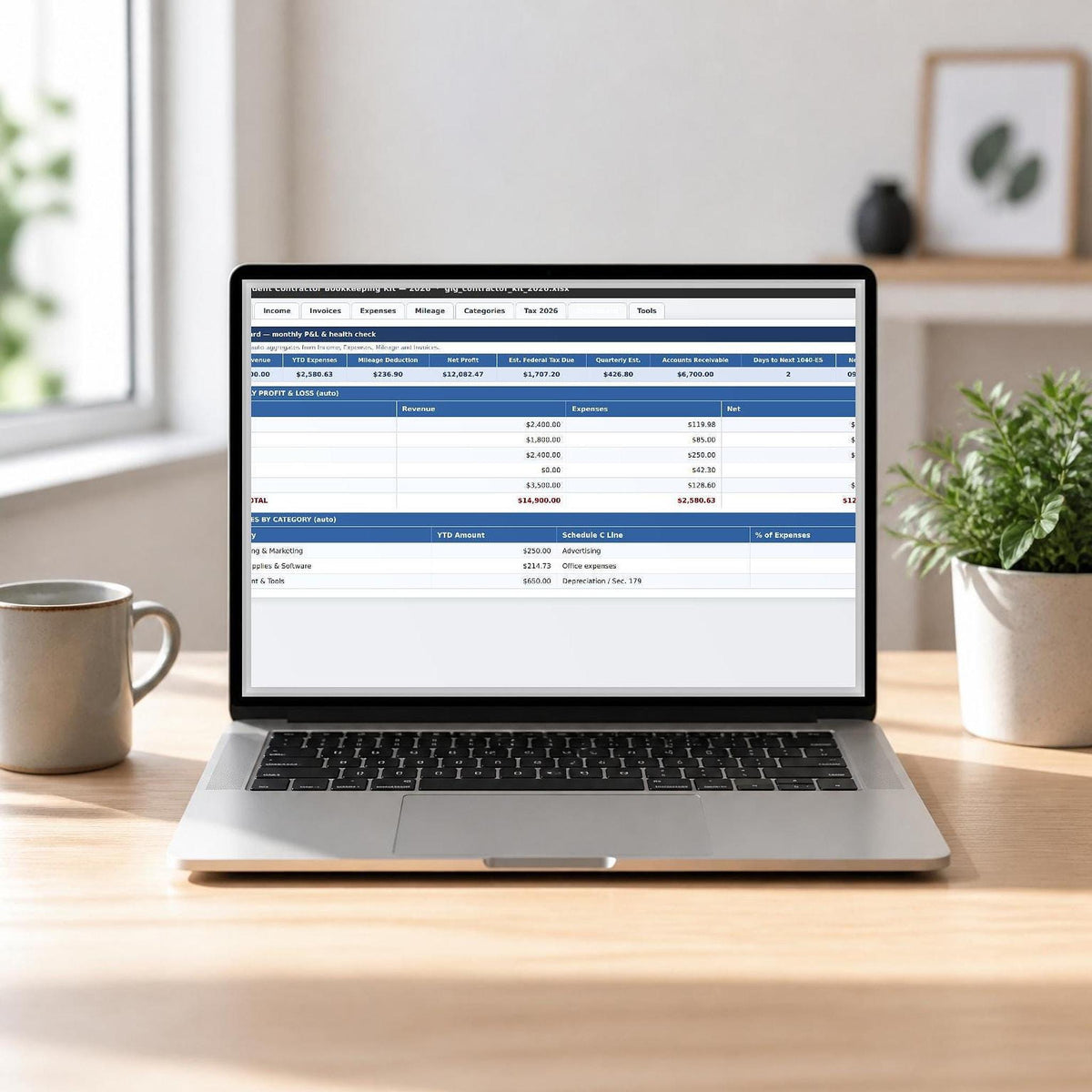 A laptop on a wooden desk displaying a spreadsheet with financial data, accompanied by a ceramic mug and a potted plant.