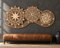 A layered wooden celestial wall art piece is mounted on a dark gray wall above a brown leather bench.