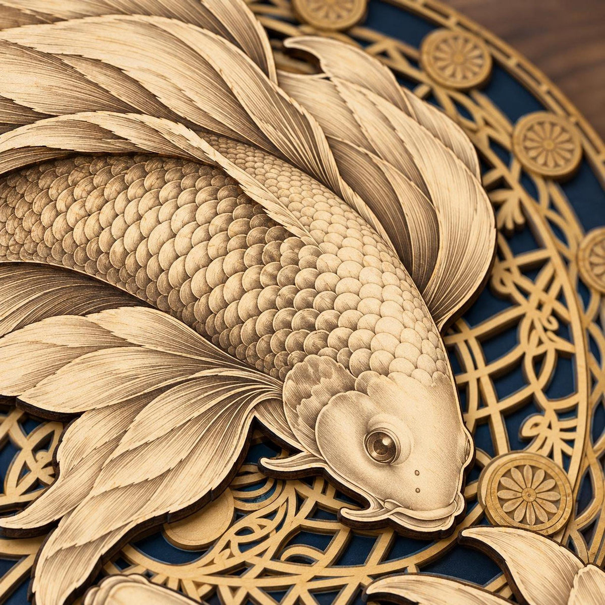 A close-up shot focusing on the intricately carved head and textured scales of the lower koi fish on the layered wooden mandala art piece.